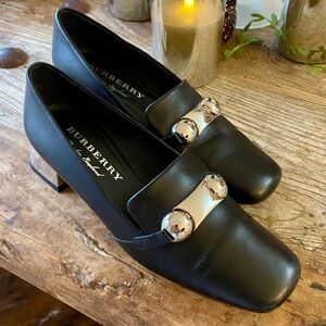 Burberry ‘Amika’. Classy Black Loafers with Silver heels and Accent Buckle. 36